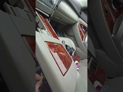 Где находится регулировочный механизм ручника на Camry V40